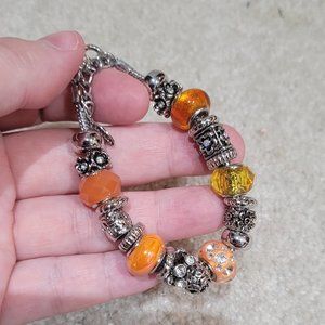 Free over $30.  Orange Bracelet